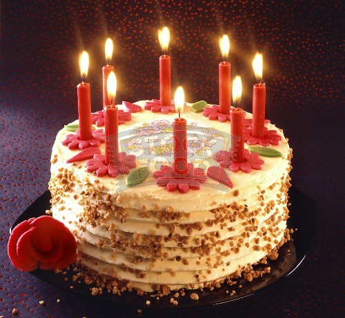 80920880_Birthday_cake_with_burning_candles925410.jpg