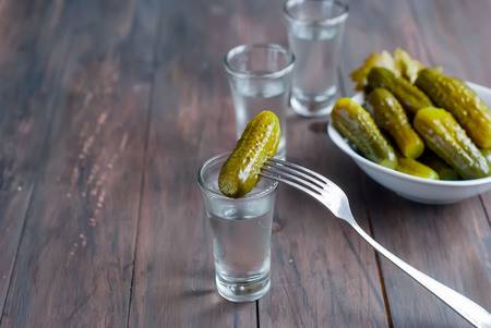 71893731-small-wine-glass-of-russian-vodka-and-salt-cucumber-snack-on-wooden-table-copy-space (450x301, 20Kb)