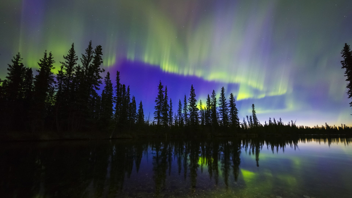 The aurora borealis reflects in the Clearwater River in Delta Junction, Alaska, USA (700x393, 222Kb)