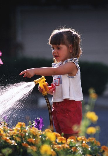 1255393409_cute-girl-watering-plants (369x530, 36Kb)