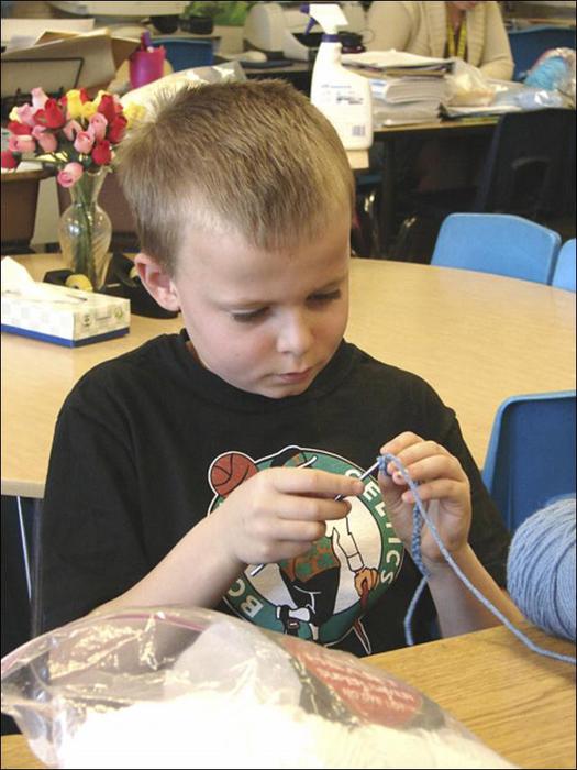 4th grader crocheting fo charity (525x700, 54Kb)