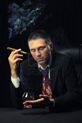 7422579-the-man-with-a-cigar-and-a-glass-of-cognac-a-dark-background (267x400, 18Kb)