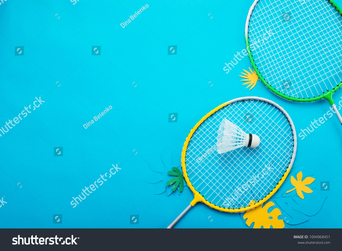 stock-photo-badminton-beach-set-and-tropical-leaves-sports-header-on-a-bright-blue-background-with-copy-space-1094968451 (700x513, 476Kb)