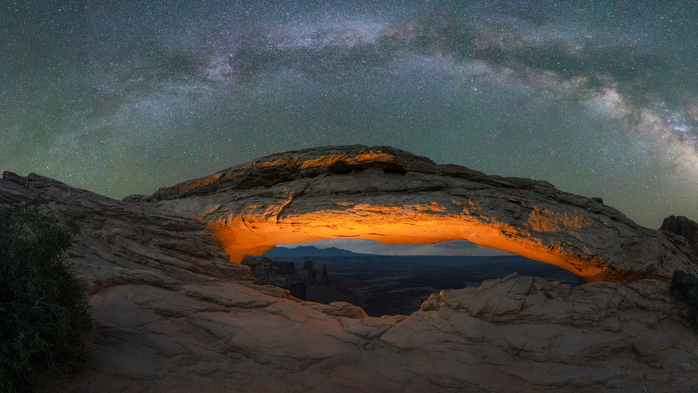 Milky Way Galaxy panorama over a lit Mesa Arch in Canyonlands National Park, Utah, USA (700x393, 319Kb)